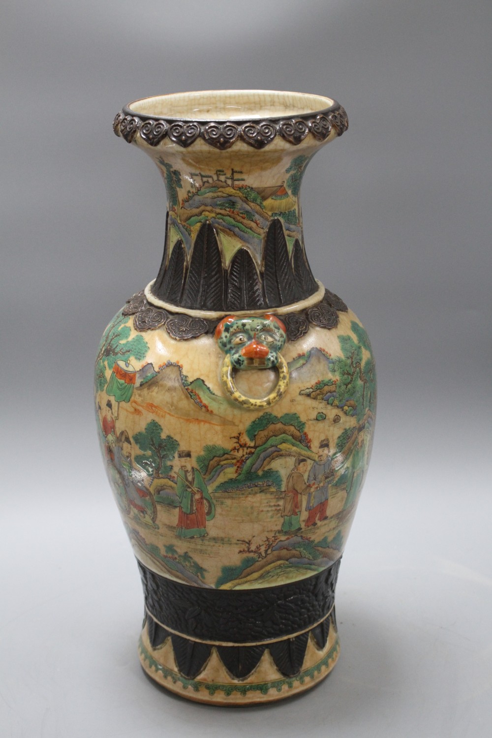 A late 19th century Chinese crackle glaze vase, decorated with figures in a continuous landscape, height 46cm